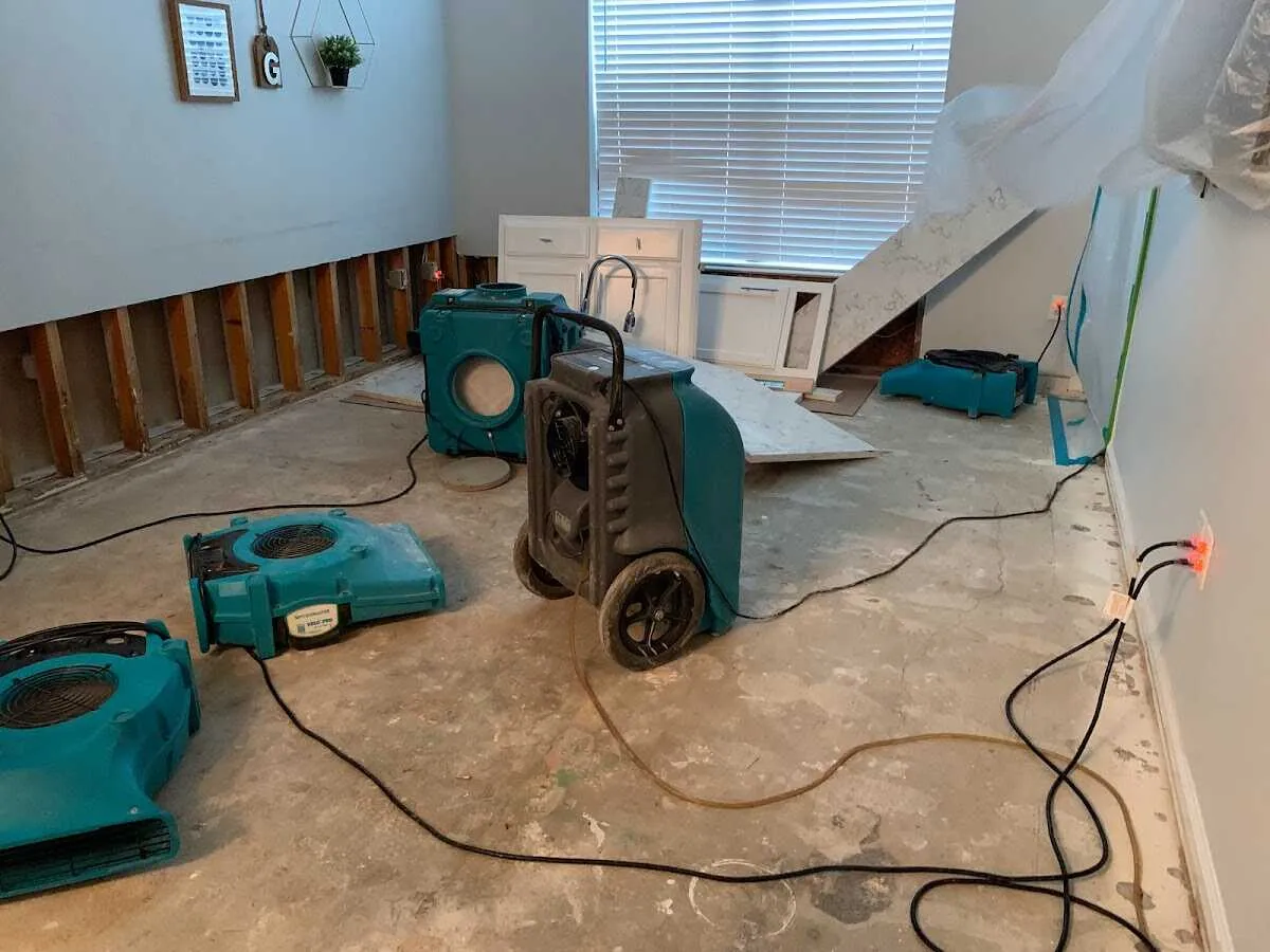 Dehumidifier in flood-cut room for Water Damage Restoration in Reedley